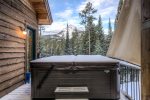 Relax and take in the views from the large outdoor hot tub, located off the main level